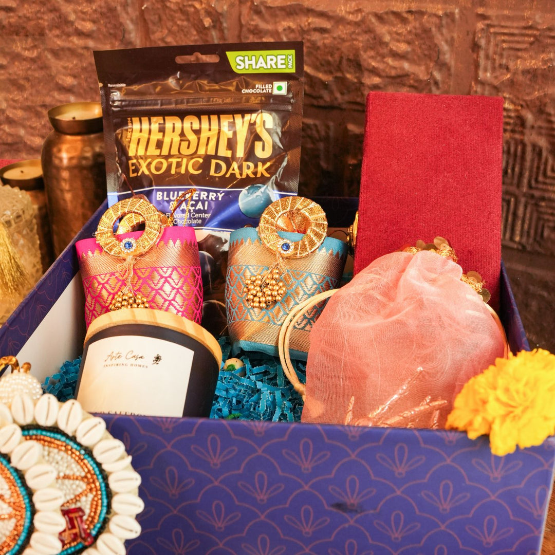 Blissful Diwali Gift Hamper | Includes 1 Hershey's Chocolate, 2 Hangings, 1 Nazar Battu, 1 Candle, 1 Nariyal, 1 Tulsi, 1 Bell, 1 Diwali Card, 1 Gift Box