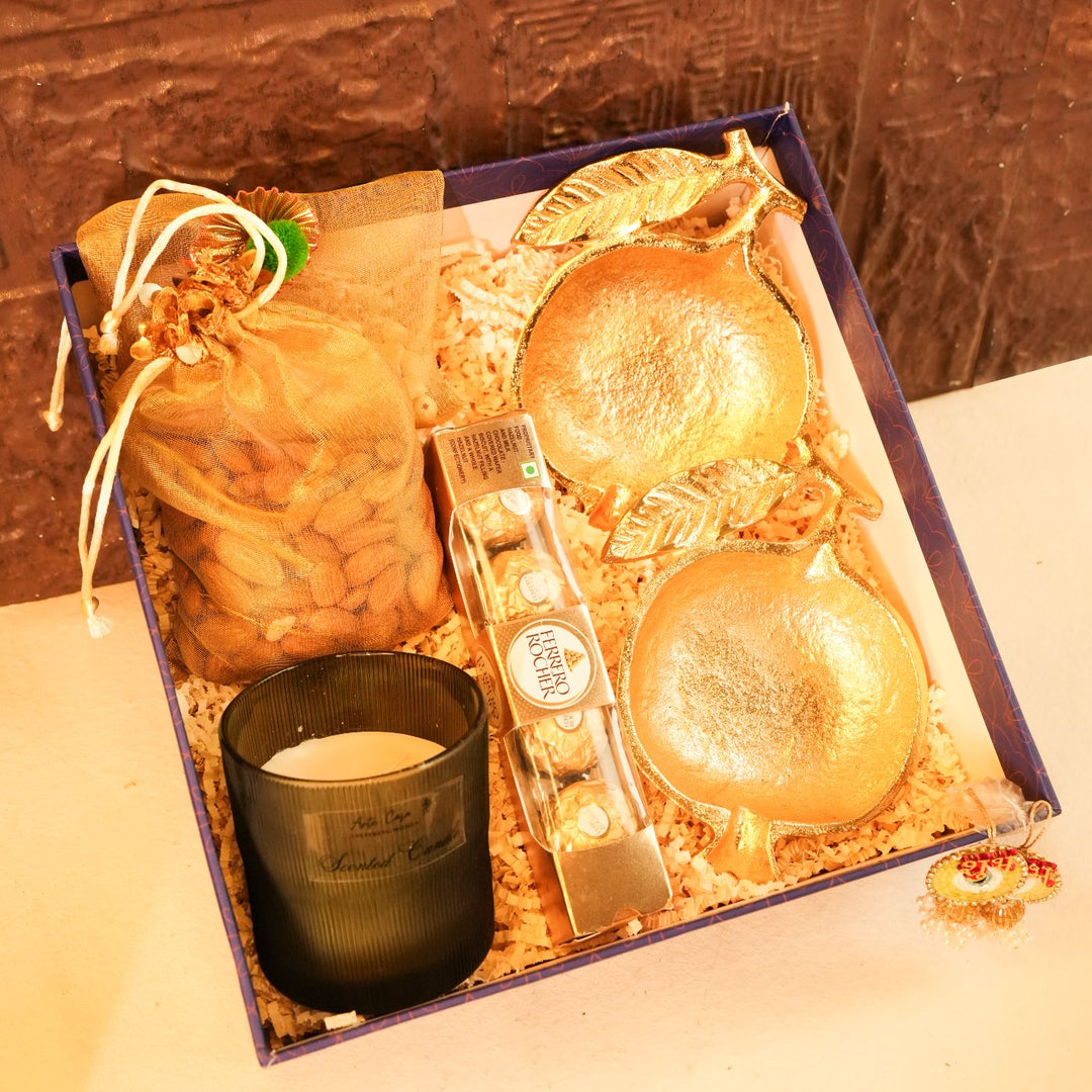 Anar Aura Diwali Gift Hamper | Includes 2 Dry Fruit Potlis, 2 Hangings, 1 Candle, 1 Ferrero Rocher Box, 2 Pomegranate Platters, 1 Diwali Card, 1 Gift Box