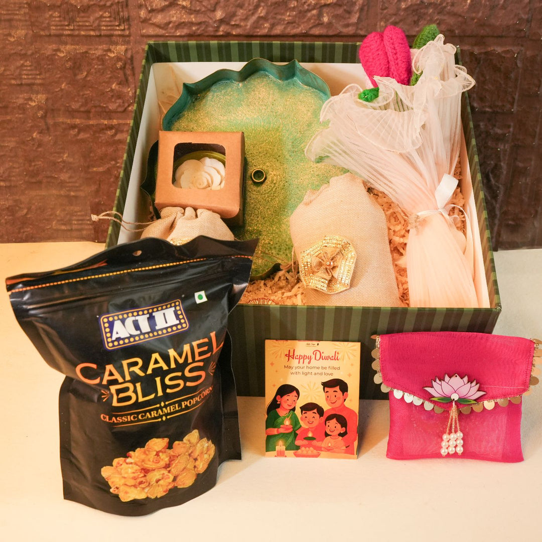 Bliss Diwali Gift Hamper | Includes 1 Urli, 2 Dry Fruit Potlis, 2 Hangings, 1 Ceramic Diffuser, 1 Popcorn Pack, 1 Flower Bunch, 1 Diwali Card, 1 Gift Box