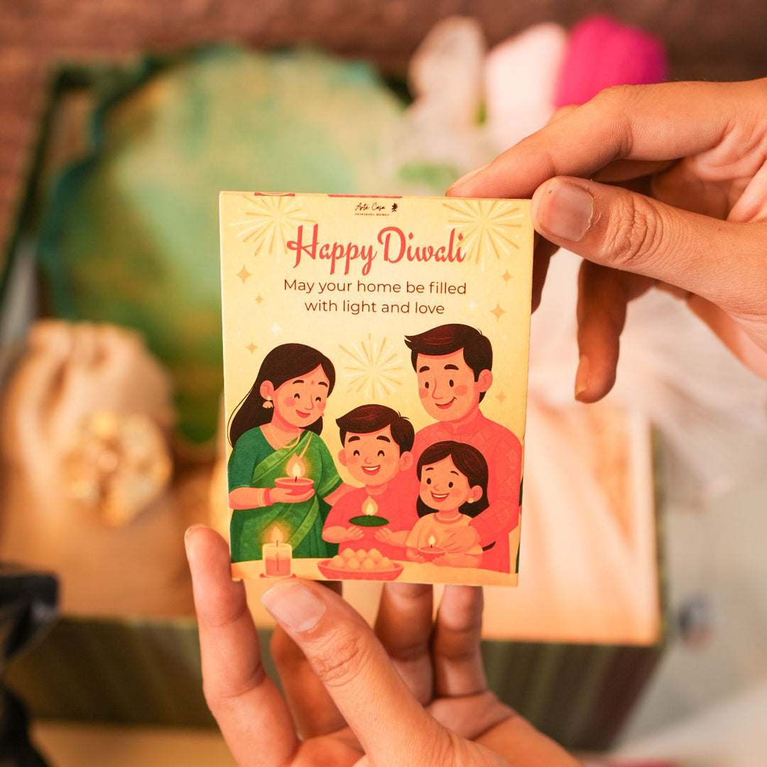 Bliss Diwali Gift Hamper | Includes 1 Urli, 2 Dry Fruit Potlis, 2 Hangings, 1 Ceramic Diffuser, 1 Popcorn Pack, 1 Flower Bunch, 1 Diwali Card, 1 Gift Box