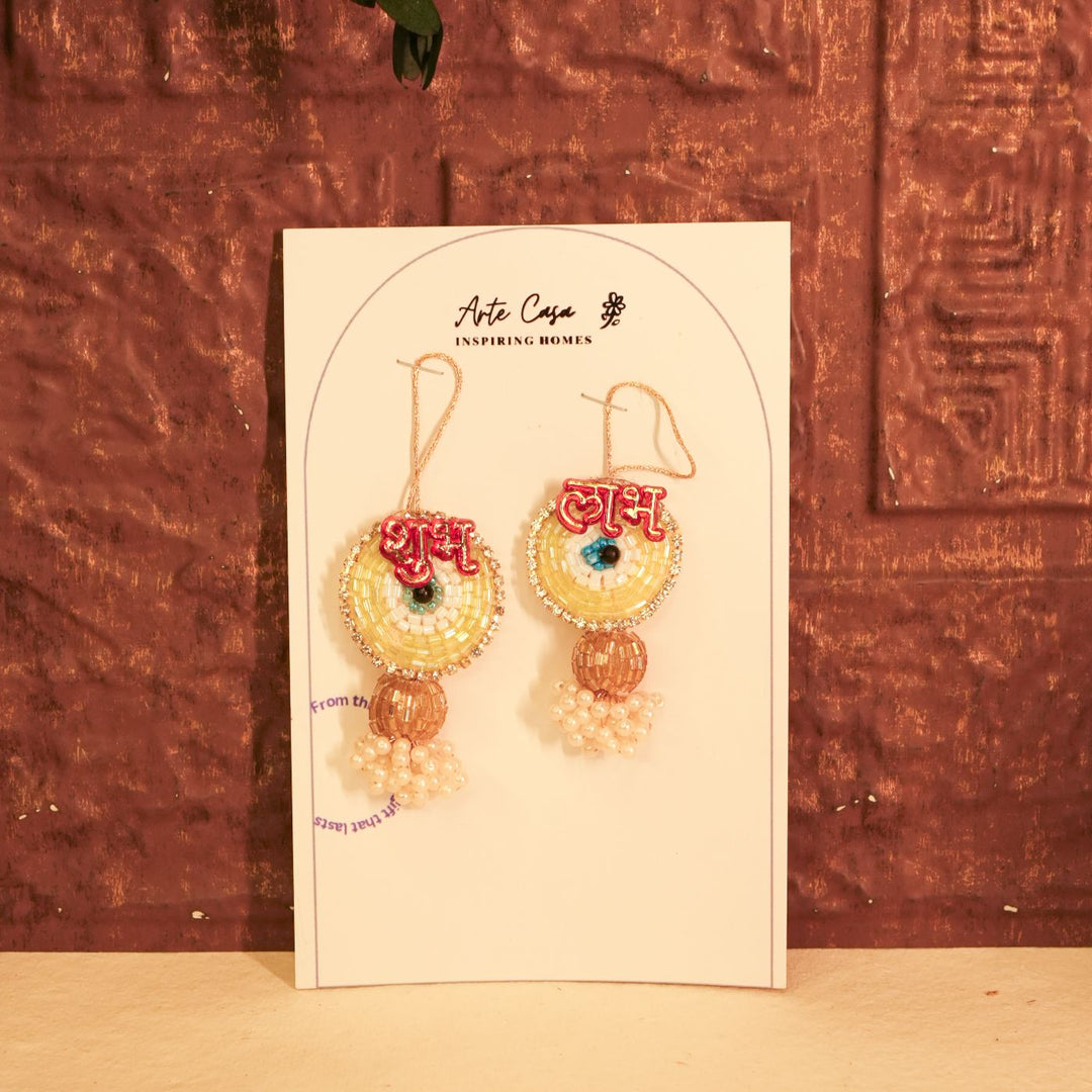 Aura Diwali Gift Hamper | Includes 2 Hangings, 1 Candle, 1 Dry Fruit Potli, 1 Decor Flower, 1 Diwali Card, 1 Round Gift Box