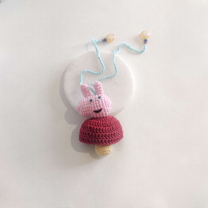 Handmade Crochet Peppa Pig Kids Rakhi With Roli Chawal - Flat on Surface