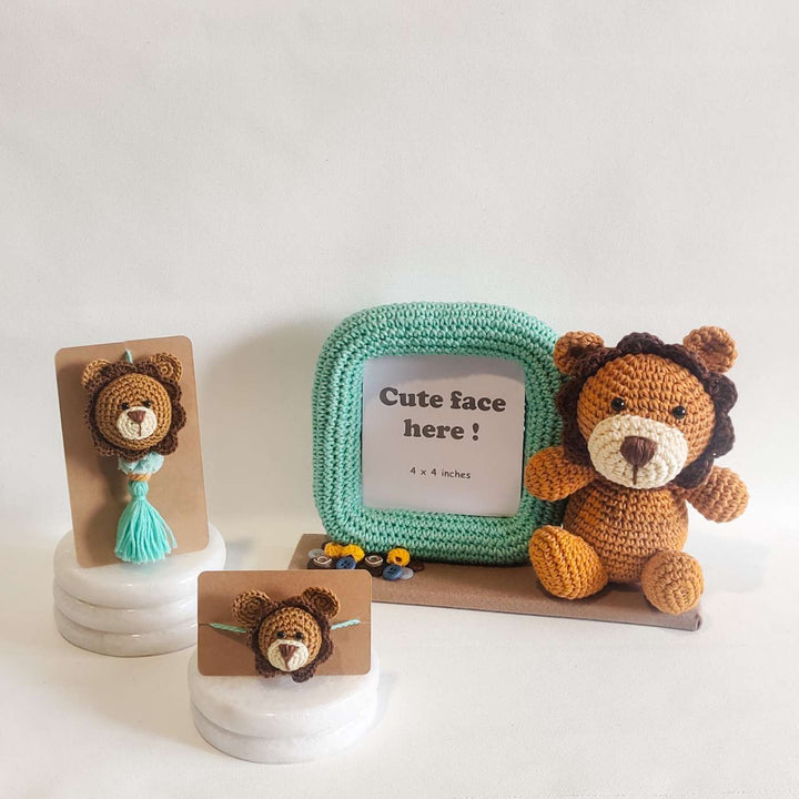 Handmade Crochet Lion Cub Kids Rakhi With Roli Chawal - Flat Lay on Circular Surface