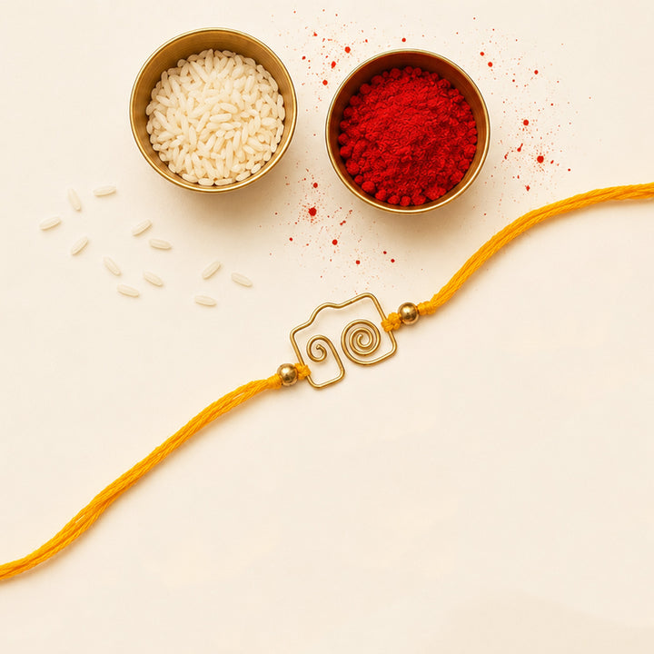 Handcrafted Wired Brass Charm Rakhi With Roli Chawal For Brother