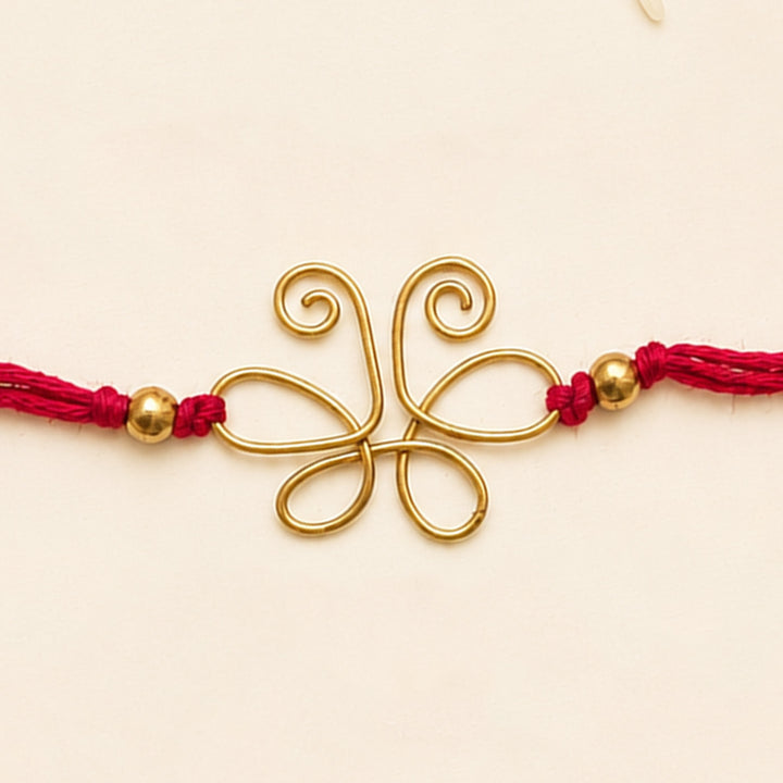 Handcrafted Wired Brass Charm Rakhi With Roli Chawal For Brother