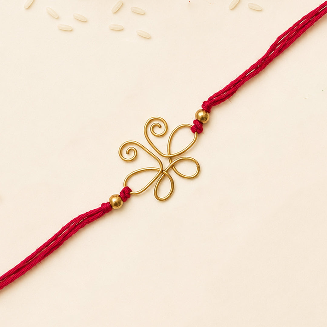 Handcrafted Wired Brass Charm Rakhi With Roli Chawal For Brother