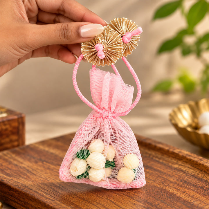 Hand-embellished Pink Floral Net Potli With Shola Flowers For Festive Gifting