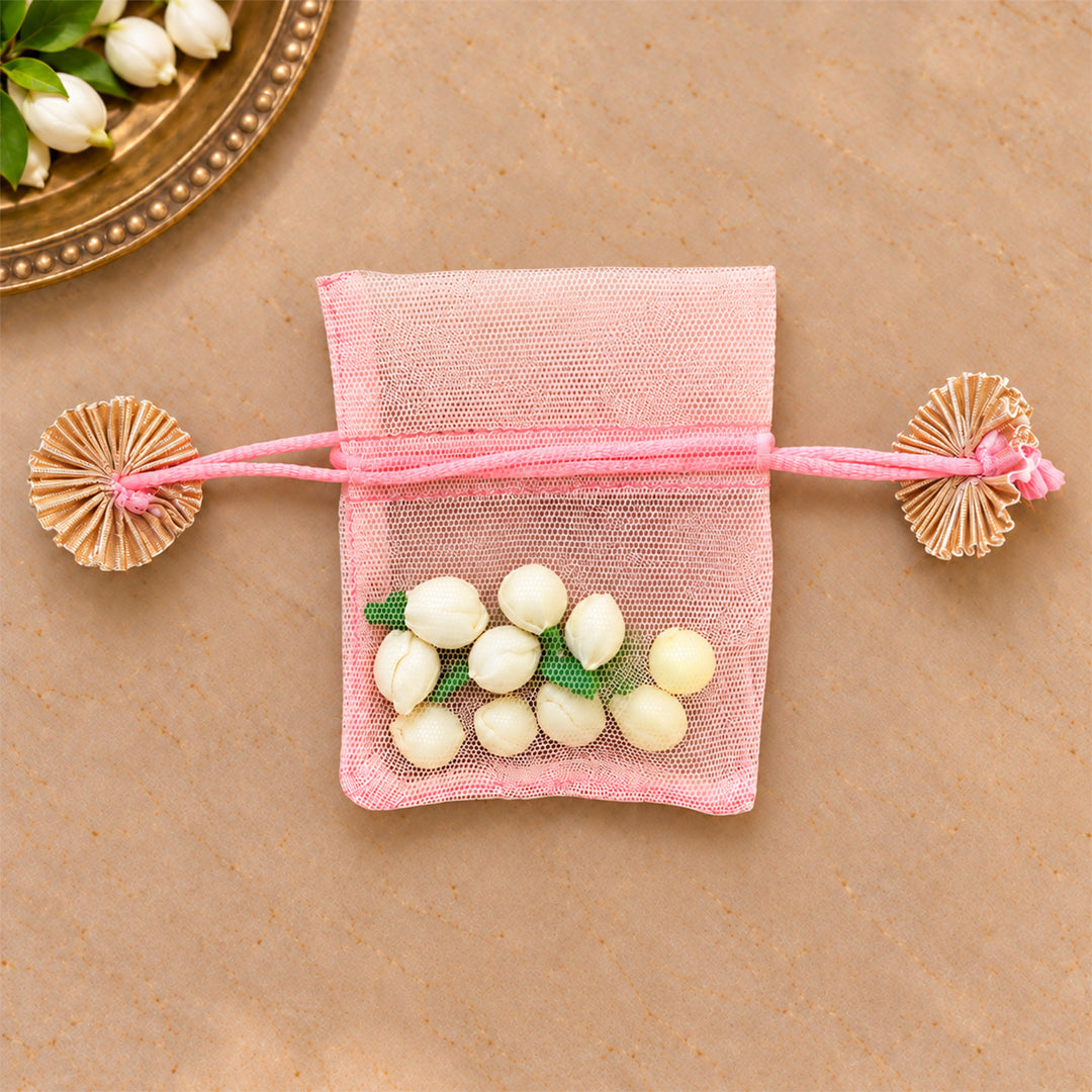 Hand-embellished Pink Floral Net Potli With Shola Flowers For Festive Gifting