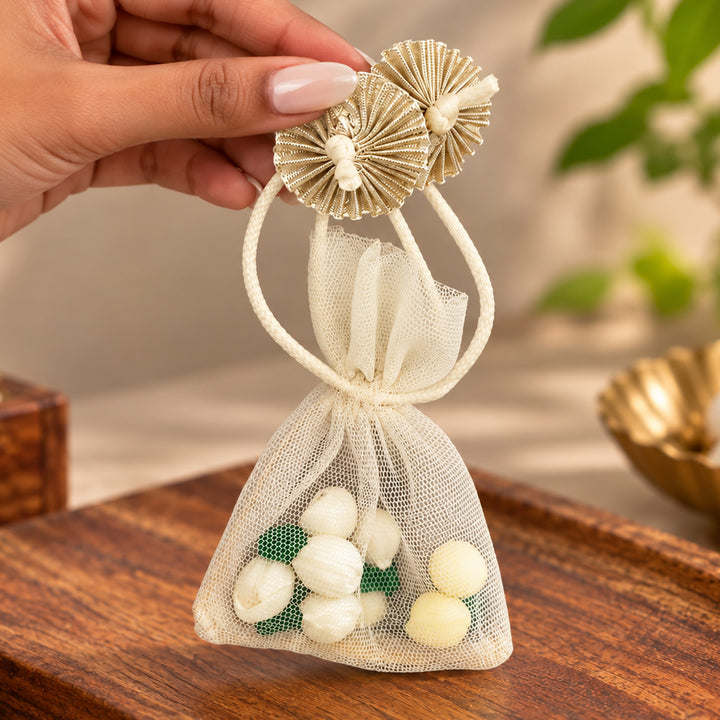 Hand-embellished Off-White Floral Net Potli With Shola Flowers For Festive Gifting