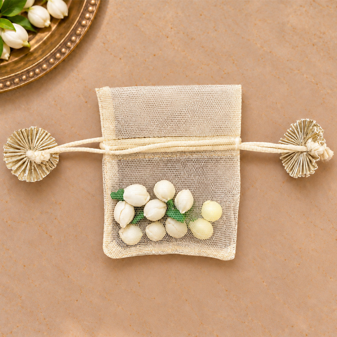 Hand-embellished Off-White Floral Net Potli With Shola Flowers For Festive Gifting