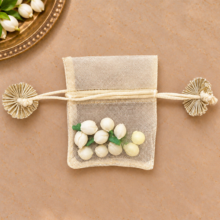 Hand-embellished Off-White Floral Net Potli With Shola Flowers For Festive Gifting