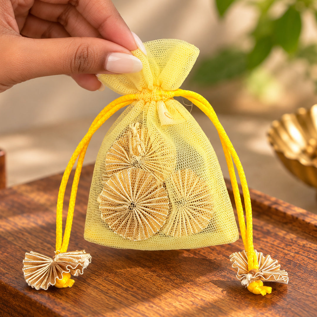 Hand-embellished Yellow Floral Net Potli With Gotapatti Flowers For Festive Gifting