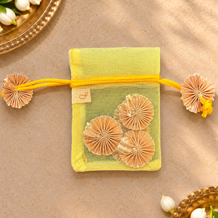 Hand-embellished Yellow Floral Net Potli With Gotapatti Flowers For Festive Gifting