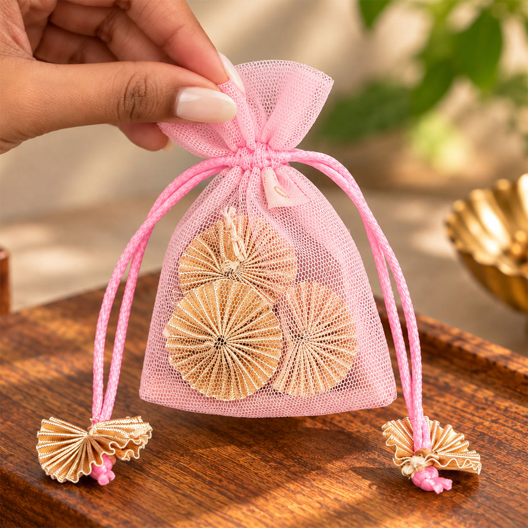 Hand-embellished Pink Floral Net Potli With Gotapatti Flowers For Festive Gifting