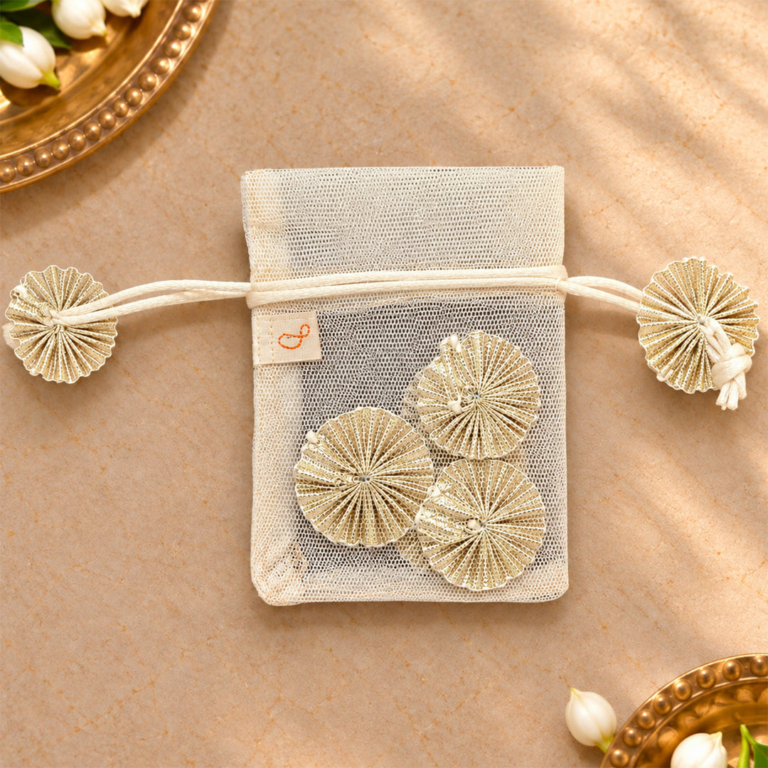 Hand-embellished Off-White Floral Net Potli With Gotapatti Flowers For Festive Gifting