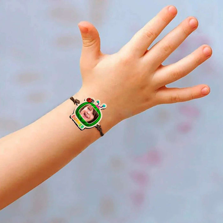 Photo Personalized Handmade Cocomelon Wooden Kids Rakhi With Roli Chawal - Child Wearing Bracelet Close-up