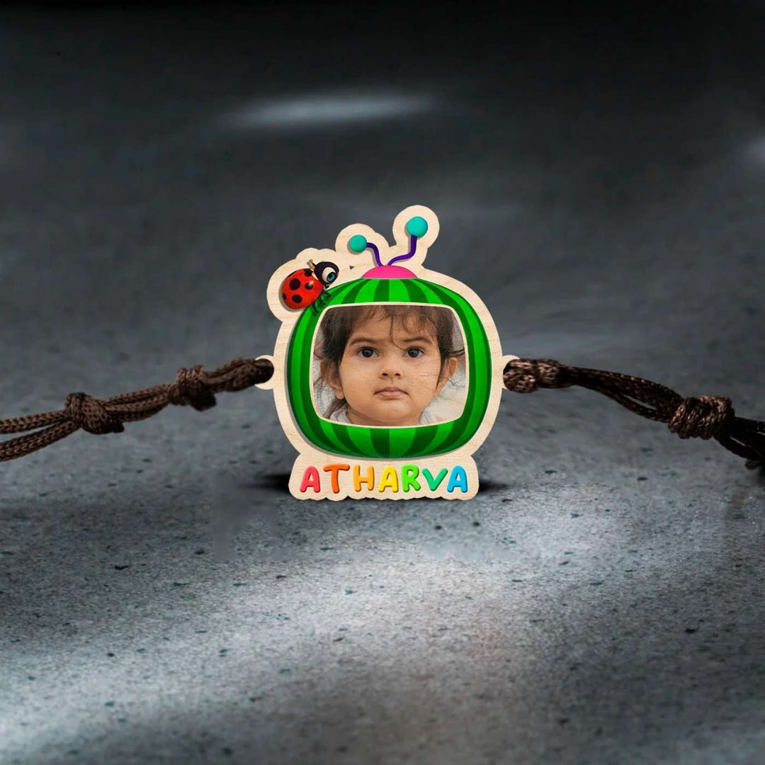 Photo Personalized Handmade Cocomelon Wooden Kids Rakhi With Roli Chawal - Flat Lay on White Background