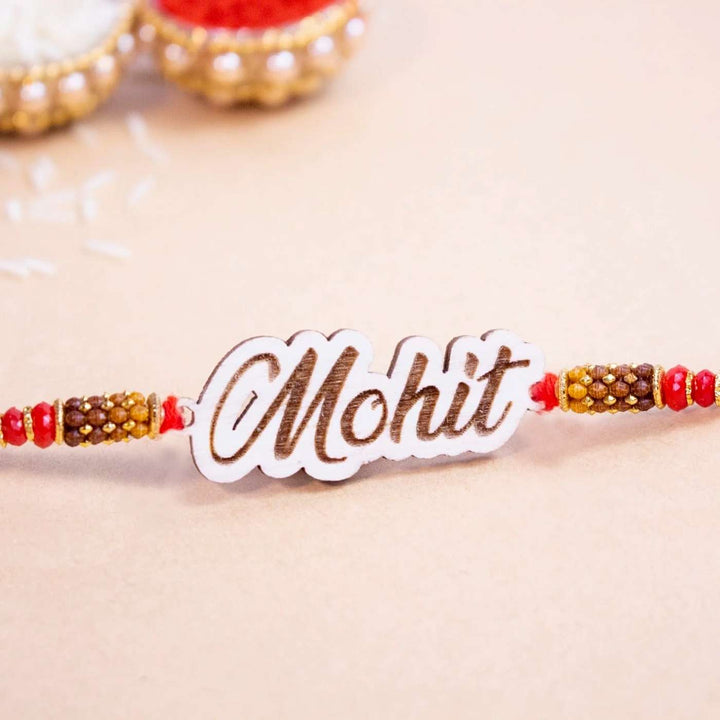 Personalized Handmade Engraved Name Wooden Rakhi With Roli Chawal - Nameplate Close-up
