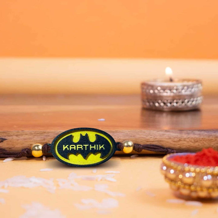 Personalized Handmade Batman Logo Wooden Kids Rakhi With Roli Chawal - Styled Rakhi with Lit Diya