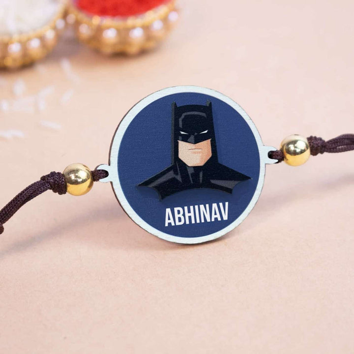 Personalized Handmade Batman Wooden Kids Rakhi With Roli Chawal - Close-up of personalized rakhi centerpiece