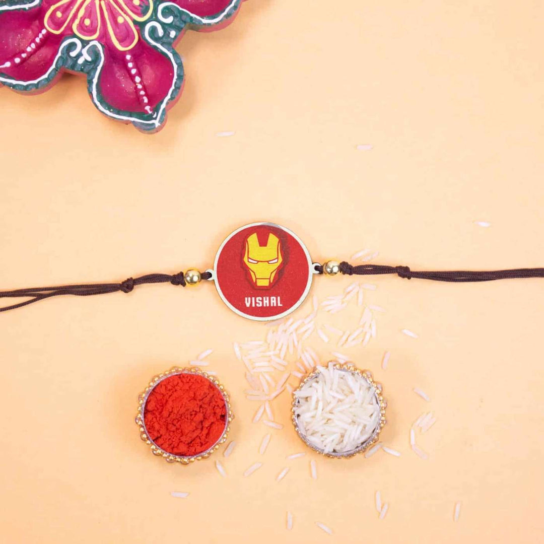 Personalized Handmade Iron Man Wooden Kids Rakhi With Roli Chawal - Flat Lay with Rakhi and Puja Items