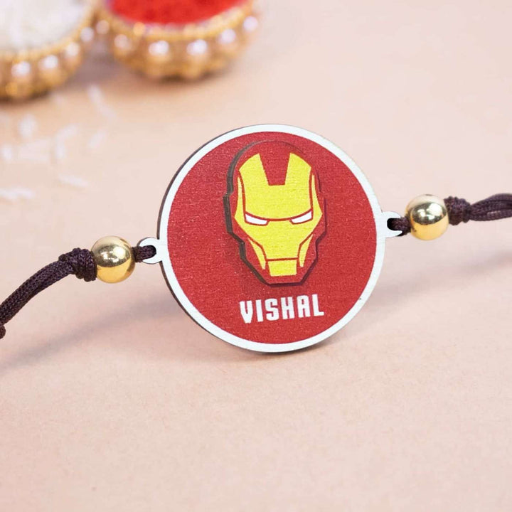 Personalized Handmade Iron Man Wooden Kids Rakhi With Roli Chawal - Close-up View with Name Personalization