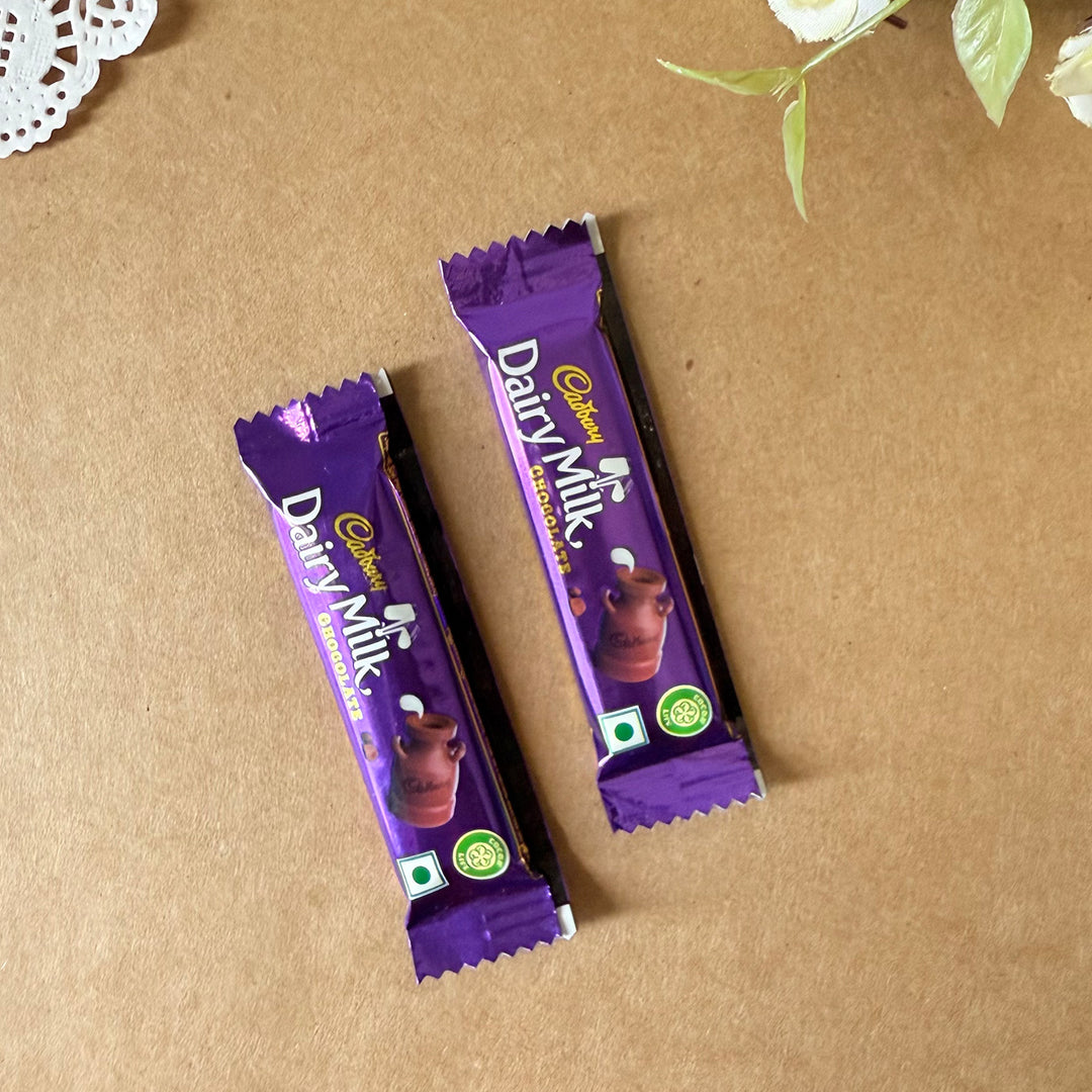 Rakhi Gift Hamper For Sister | Includes 1 Mini Photo Frame, 1 Rakhi, 1 Roli Chawal, 1 Letter And 2 Diary Milk