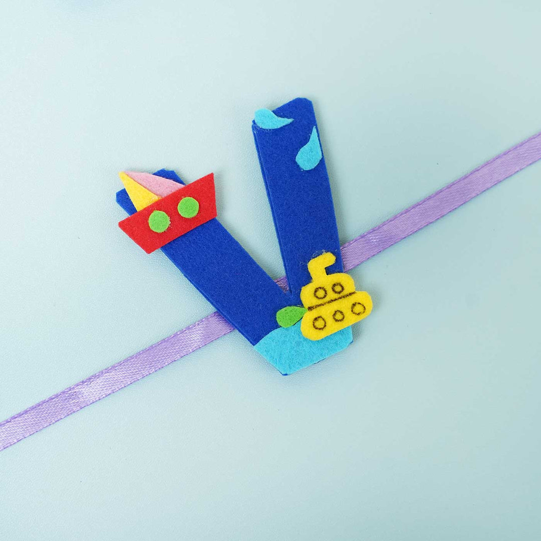 Personalised Handmade Boat Felt Rakhi With Chocolates Roli Chawal - Close-up of Blue V Rakhi