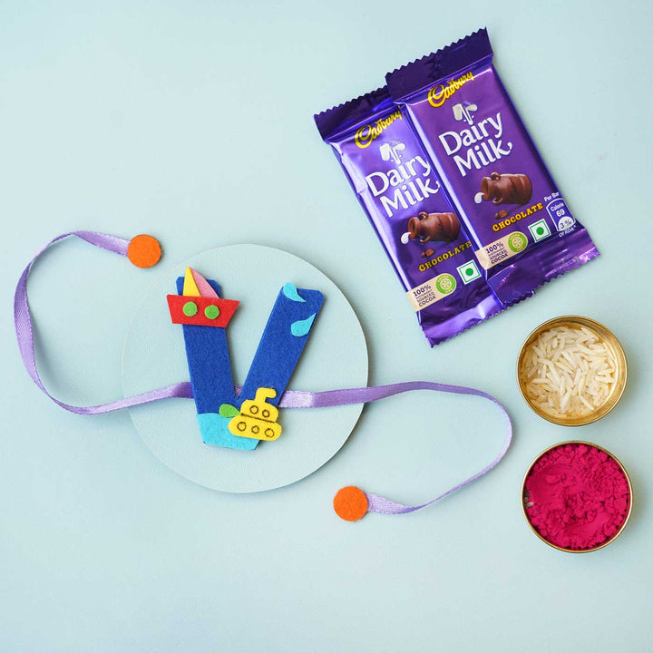 Personalised Handmade Boat Felt Rakhi With Chocolates Roli Chawal - Blue V Rakhi with Gifts Flat Lay