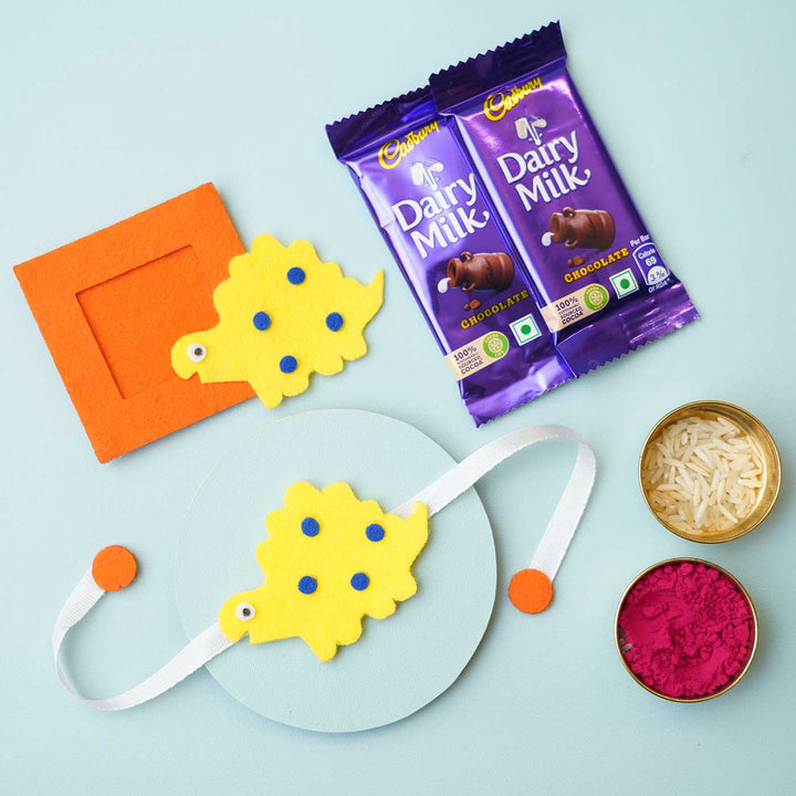 Handmade Blue Dinosaur Felt Rakhi Photoframe Magnet With Chocolates Roli Chawal - Rakhi with Rakhi Gift Set Items