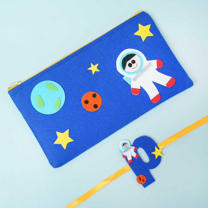 Personalised Handmade Felt Rakhi Astronaut Pouch With Chocolates Roli Chawal - Front View with Decorative Items