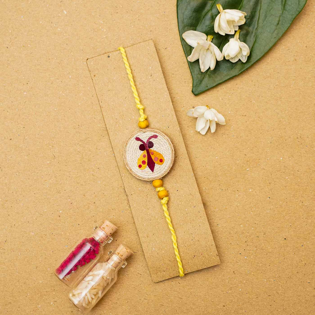 Handmade Eco-friendly Kanjoos Makhichoos Pressed Flower Rakhi with Roli Chawal