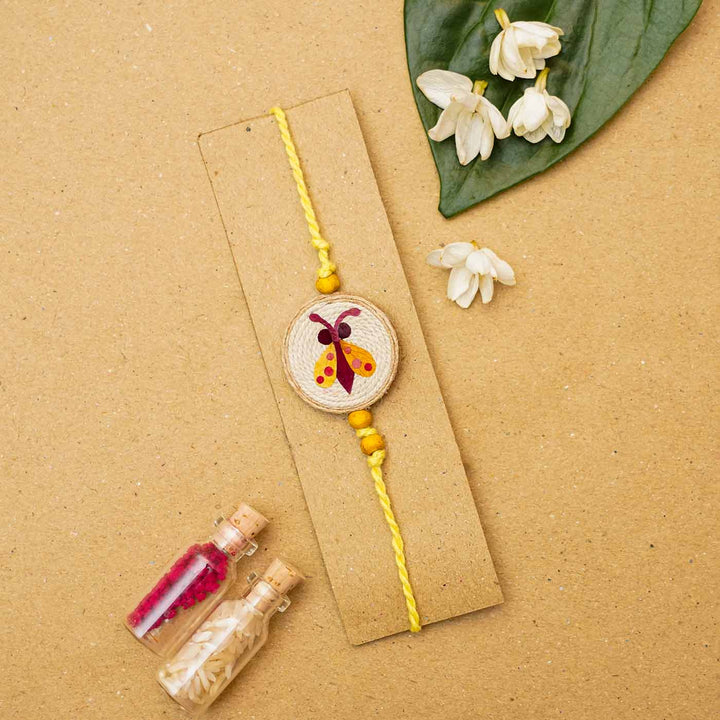 Handmade Eco-friendly Kanjoos Makhichoos Pressed Flower Rakhi with Roli Chawal
