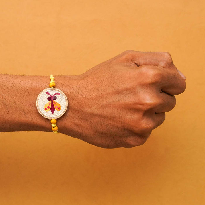 Handmade Eco-friendly Kanjoos Makhichoos Pressed Flower Rakhi with Roli Chawal