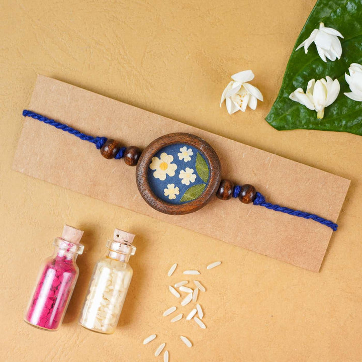 Handmade Eco-friendly Jasmine Pressed Flower Rakhi with Roli Chawal