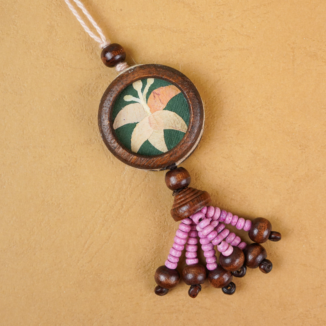 Handmade Eco Friendly Lily Pressed Flower Lumba Rakhi For Bhabhi With Roli Chawal - Close-up of single rakhi decoration