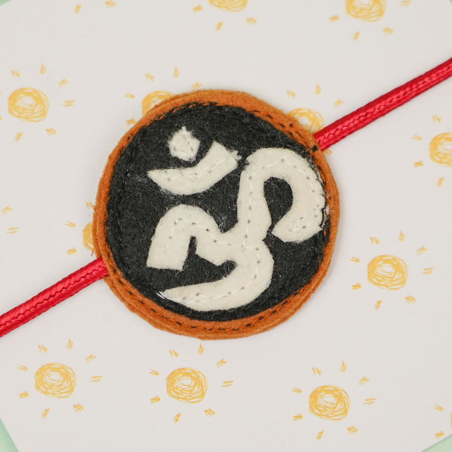 Handmade Om Theme Relegious Felt Kids Rakhi - Close-up of Charm Detail