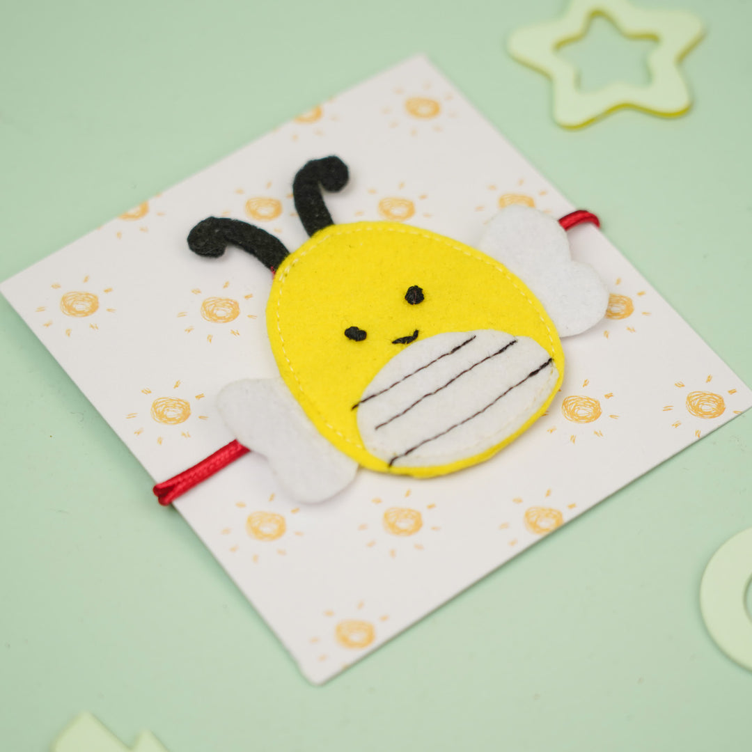 Handmade Squish Mallows Bumblebee Theme Felt Kids Rakhi - Angled View on Card