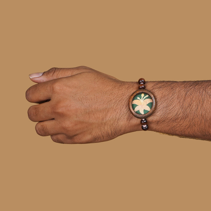 Handmade Eco Friendly Lily Pressed Flower Rakhi With Roli Chawal - Worn on wrist display