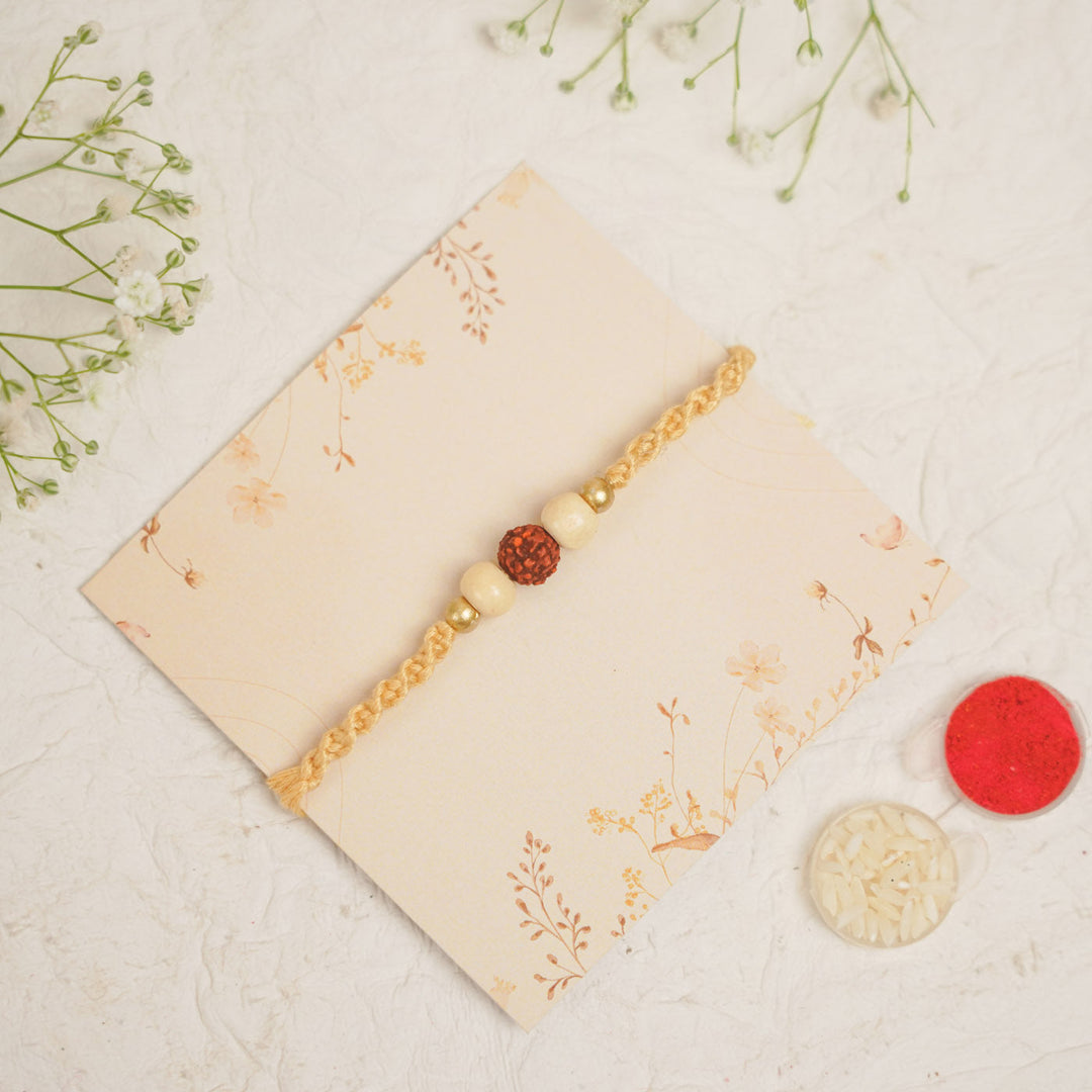 Handmade Pearl Rudraksha Rakhi With Roli Chawal - Bracelet Display with Decorative Items