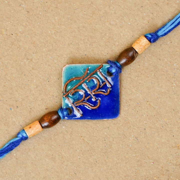 Handmade Sis Blue Copper Enamel Rakhi With Chocolates & Roli Chawal