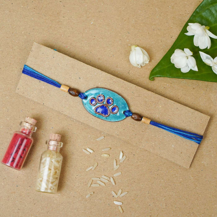 Handmade Pawfect Copper Enamel Rakhi With Chocolates & Roli Chawal