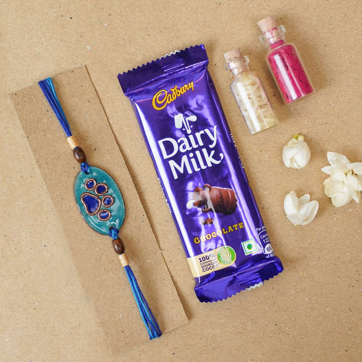 Handmade Pawfect Copper Enamel Rakhi With Chocolates & Roli Chawal