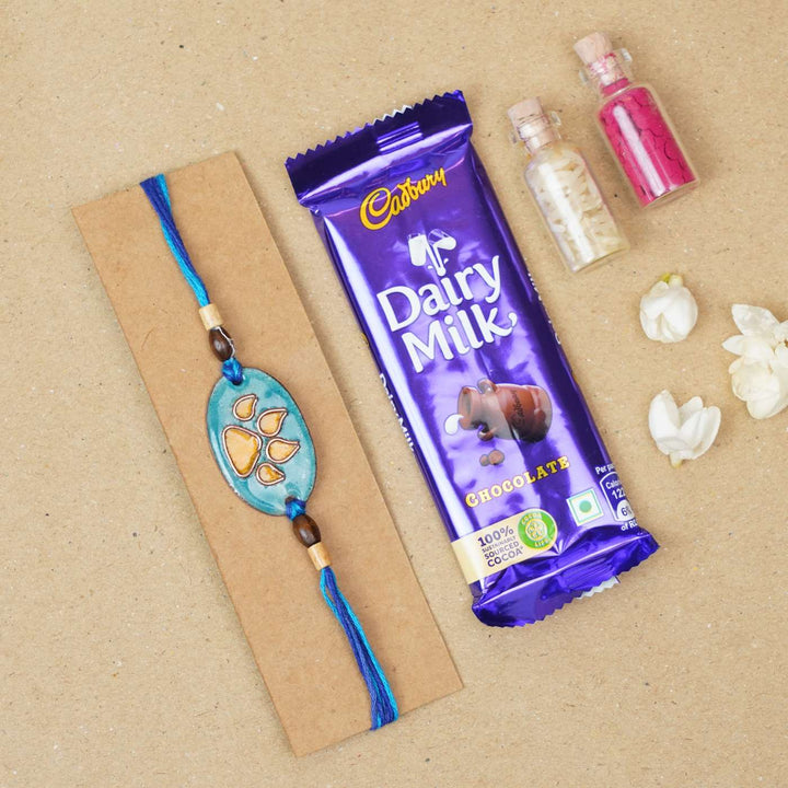 Handmade Pawfect Copper Enamel Rakhi With Chocolates & Roli Chawal