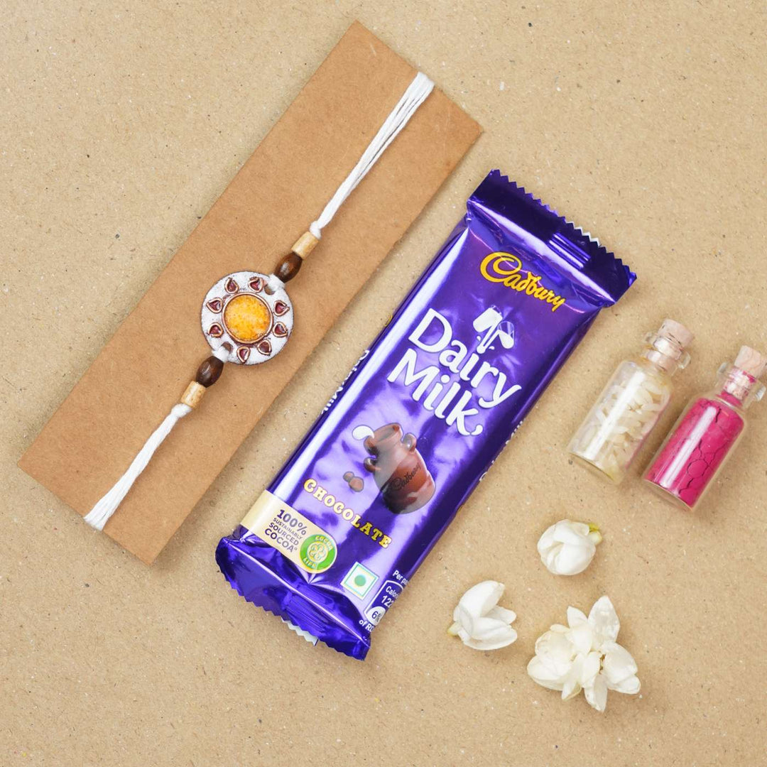 Handmade Sooraj White Copper Enamel Rakhi With Chocolates & Roli Chawal
