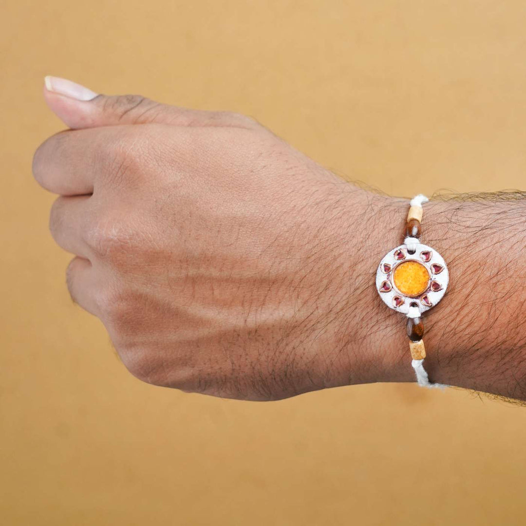 Handmade Sooraj White Copper Enamel Rakhi With Chocolates & Roli Chawal
