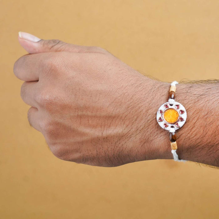 Handmade Sooraj White Copper Enamel Rakhi With Chocolates & Roli Chawal