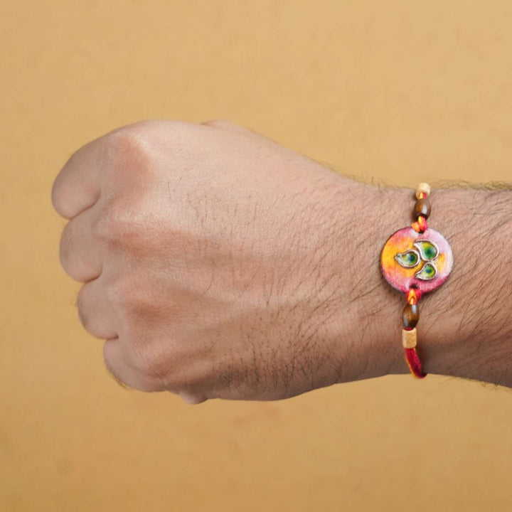 Handmade Morpankh Copper Enamel Rakhi With Chocolates & Roli Chawal