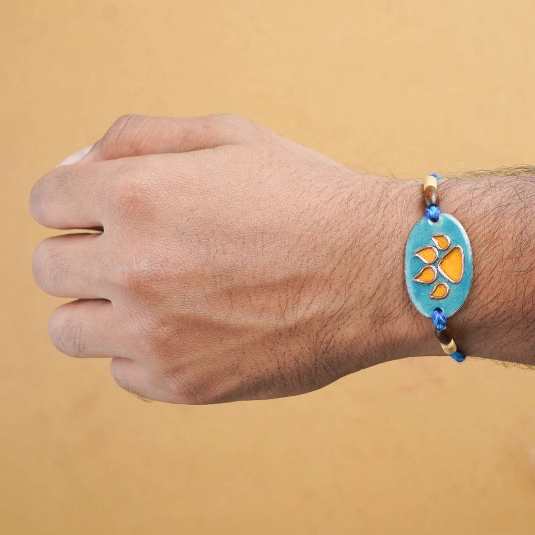 Handmade Pawfect Copper Enamel Rakhi With Chocolates & Roli Chawal