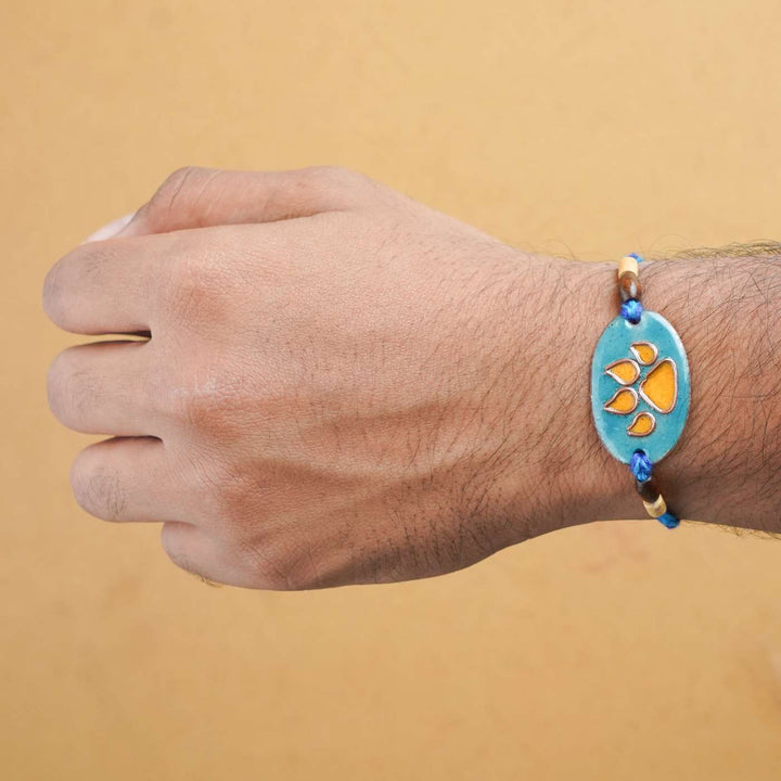 Handmade Pawfect Copper Enamel Rakhi With Chocolates & Roli Chawal